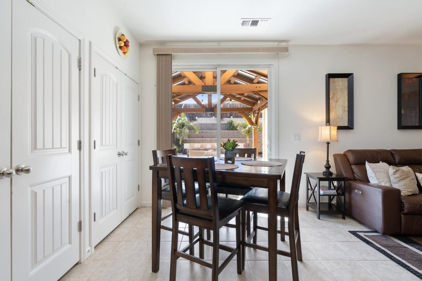 2448 Vallarta Drive Bay Point, CA 94565 - Photo 15 of 52 a view of a dining room with furniture a chandelier and wooden floor