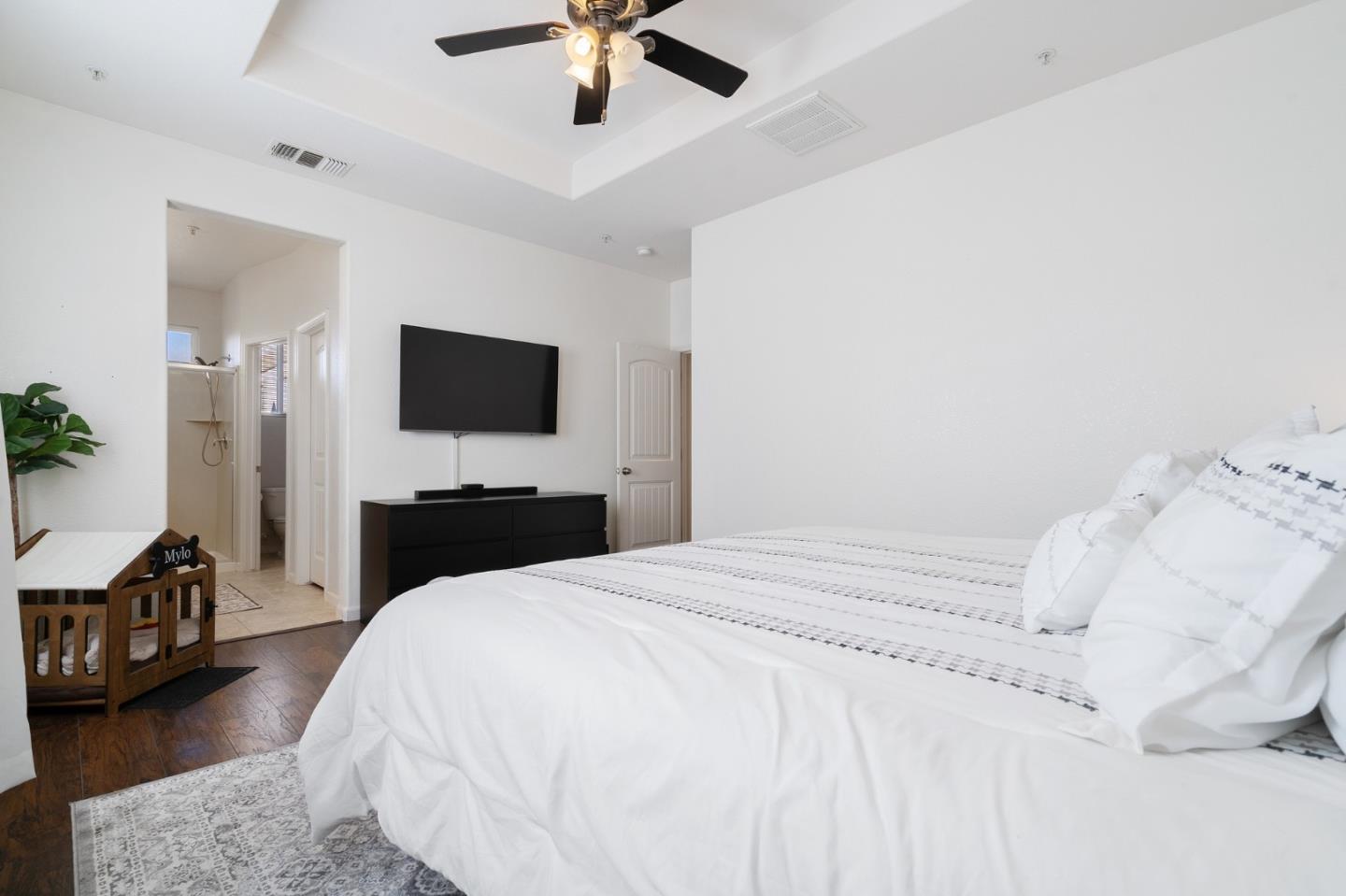 2448 Vallarta Drive Bay Point, CA 94565 - Photo 19 of 52 a bedroom with a bed and a chandelier