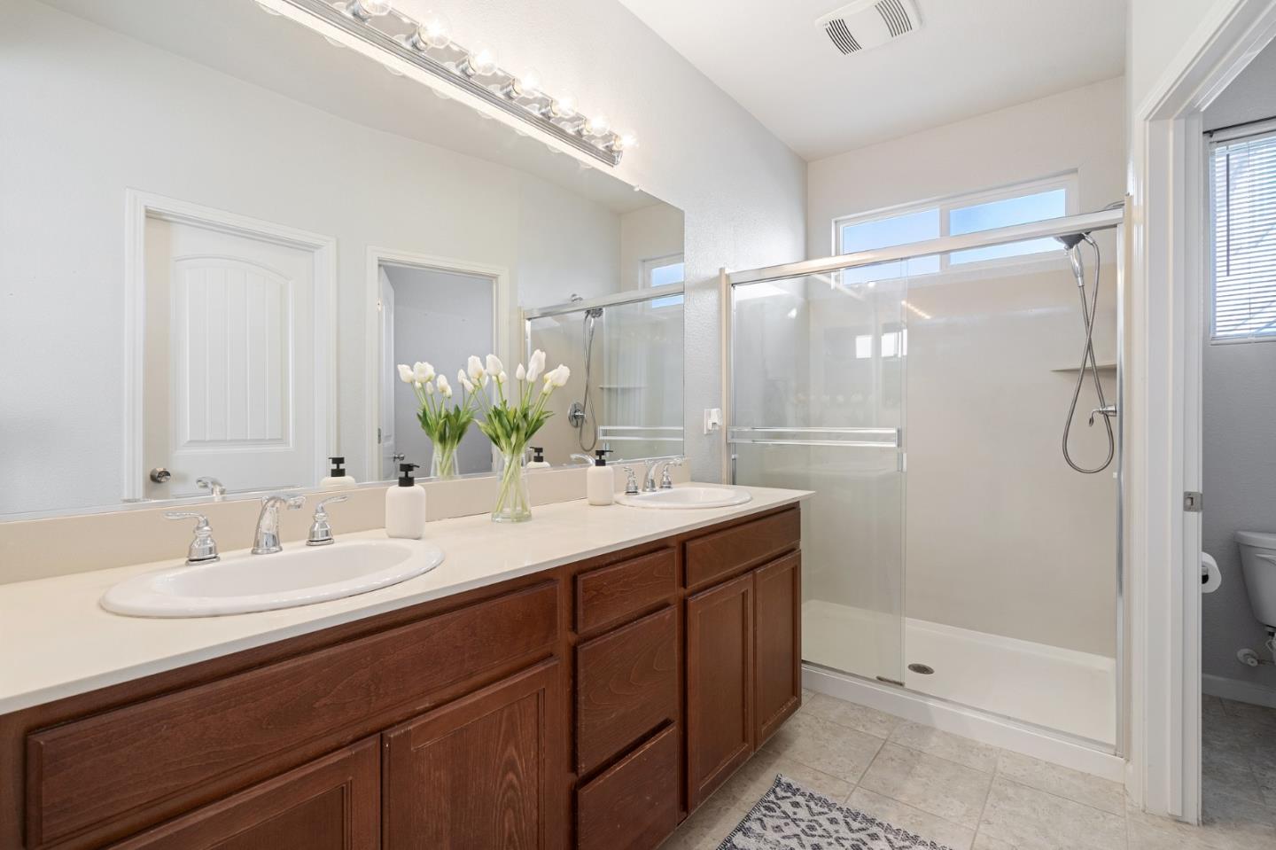 2448 Vallarta Drive Bay Point, CA 94565 - Photo 21 of 52 a bathroom with a double vanity sink mirror and shower