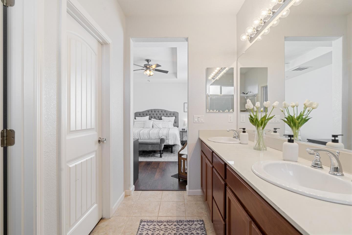 2448 Vallarta Drive Bay Point, CA 94565 - Photo 22 of 52 a en suite bathroom with a double vanity sink and a mirror