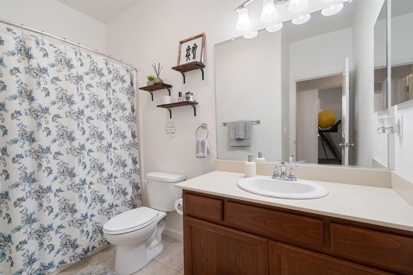 2448 Vallarta Drive Bay Point, CA 94565 - Photo 26 of 52 a bathroom with a sink a toilet and a mirror