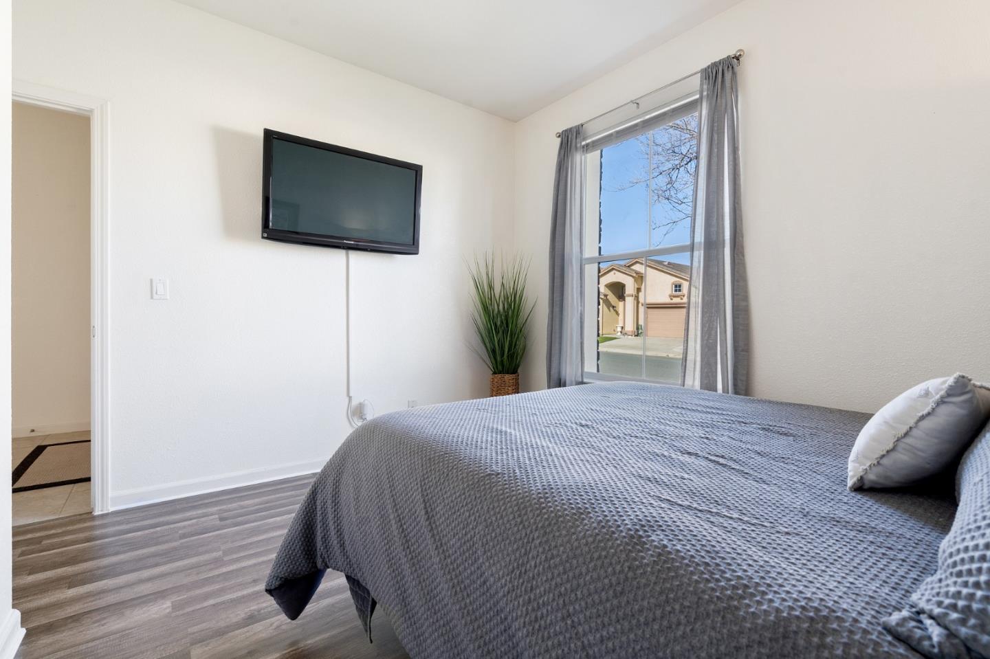 2448 Vallarta Drive Bay Point, CA 94565 - Photo 30 of 52 a bedroom with a bed and a flat screen tv