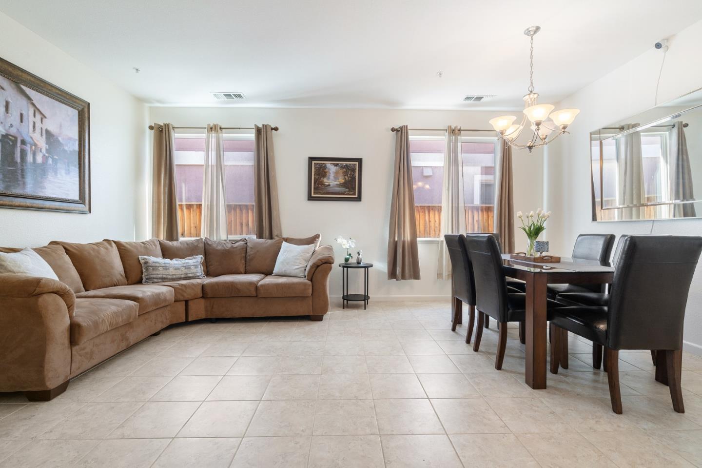 2448 Vallarta Drive Bay Point, CA 94565 - Photo 4 of 52 a living room with furniture a chandelier and a dining table