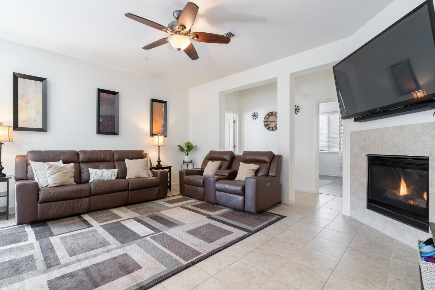 2448 Vallarta Drive Bay Point, CA 94565 - Photo 8 of 52 a living room with furniture a flat screen tv and a fireplace