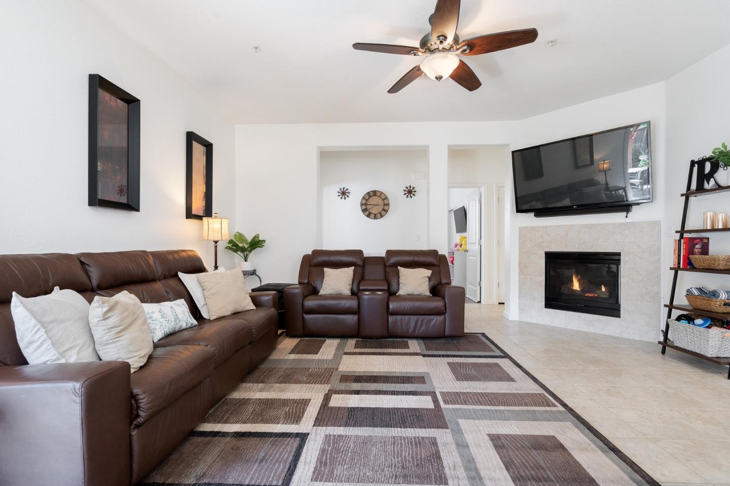 2448 Vallarta Drive Bay Point, CA 94565 - Photo 9 of 52 a living room with furniture a flat screen tv and a fireplace