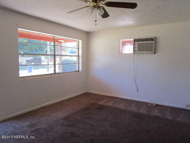 6912 Corday Road Jacksonville, FL 32208 - Photo 2 of 10 a view of an empty room with a window