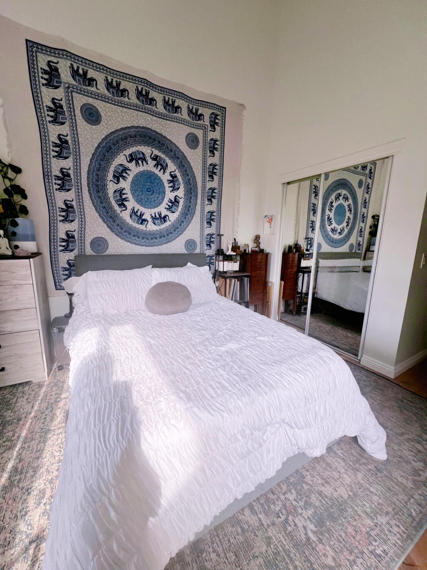 20371 Bluffside Circle, Unit B404 Huntington Beach, CA 92646 - Photo 18 of 40 a bedroom with a bed and a closet with wooden floor