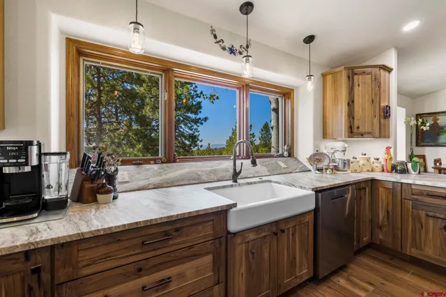 a kitchen with lots of counter top space and a sink