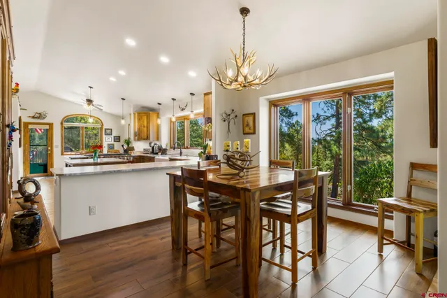 a view of a dining room with furniture window and outside view
