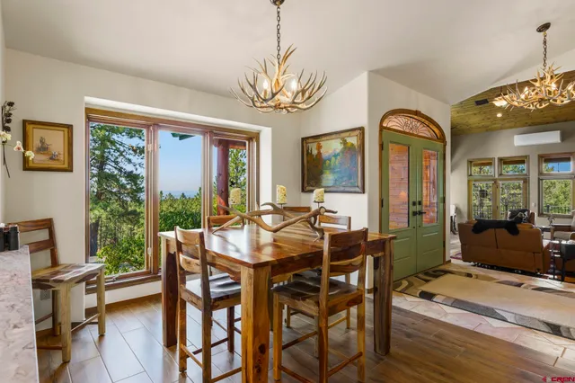 a view of a dining room with furniture window and outside view