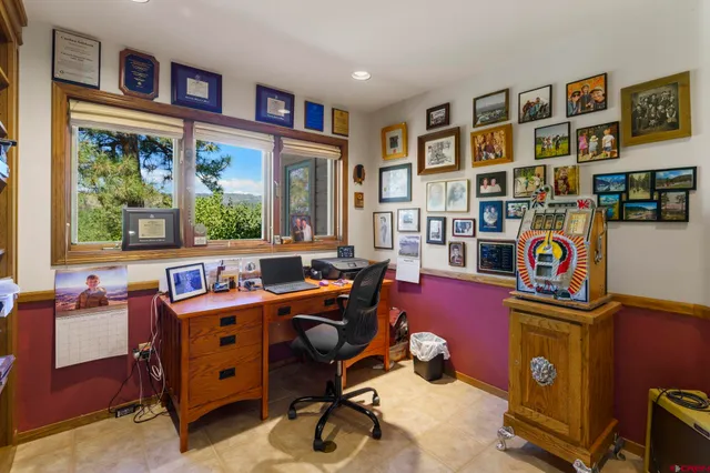 a room with workspace and a window