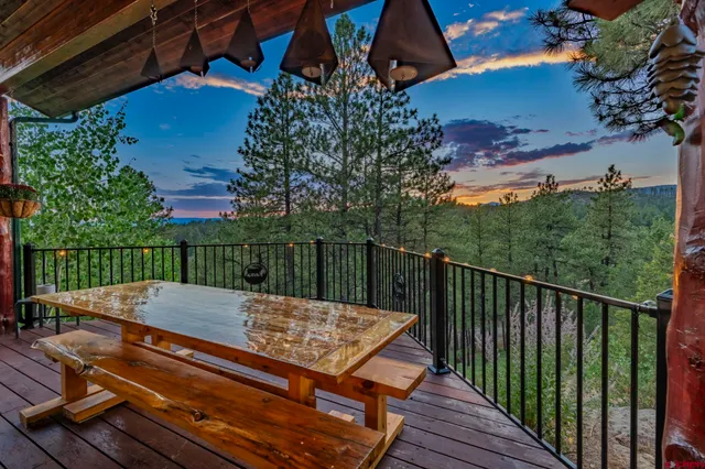 a view of a wooden deck with a bench
