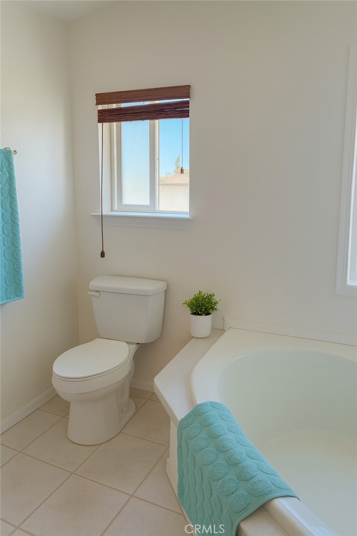13130 Evergreen Road Pinon Hills, CA 92372 - Photo 15 of 22 a bathroom with a toilet and a rug