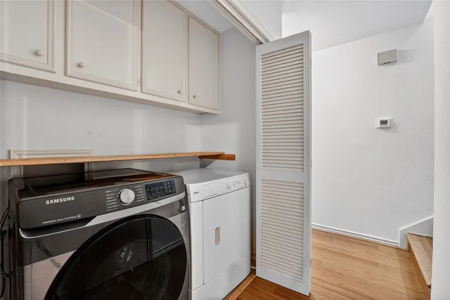 a bathroom with a sink vanity and a mirror
