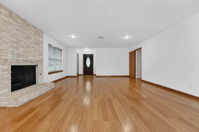 a kitchen with granite countertop a stove top oven and cabinets