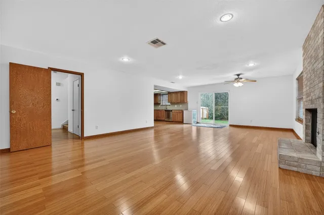 a kitchen with stainless steel appliances granite countertop wooden cabinets stove top oven and sink