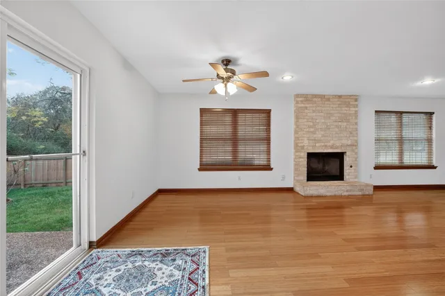 a kitchen with stainless steel appliances granite countertop a refrigerator stove and sink