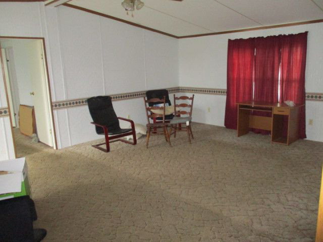 2658 Tribble Road Fort Valley, GA 31030 - Photo 4 of 6 a livingroom with furniture and a chair