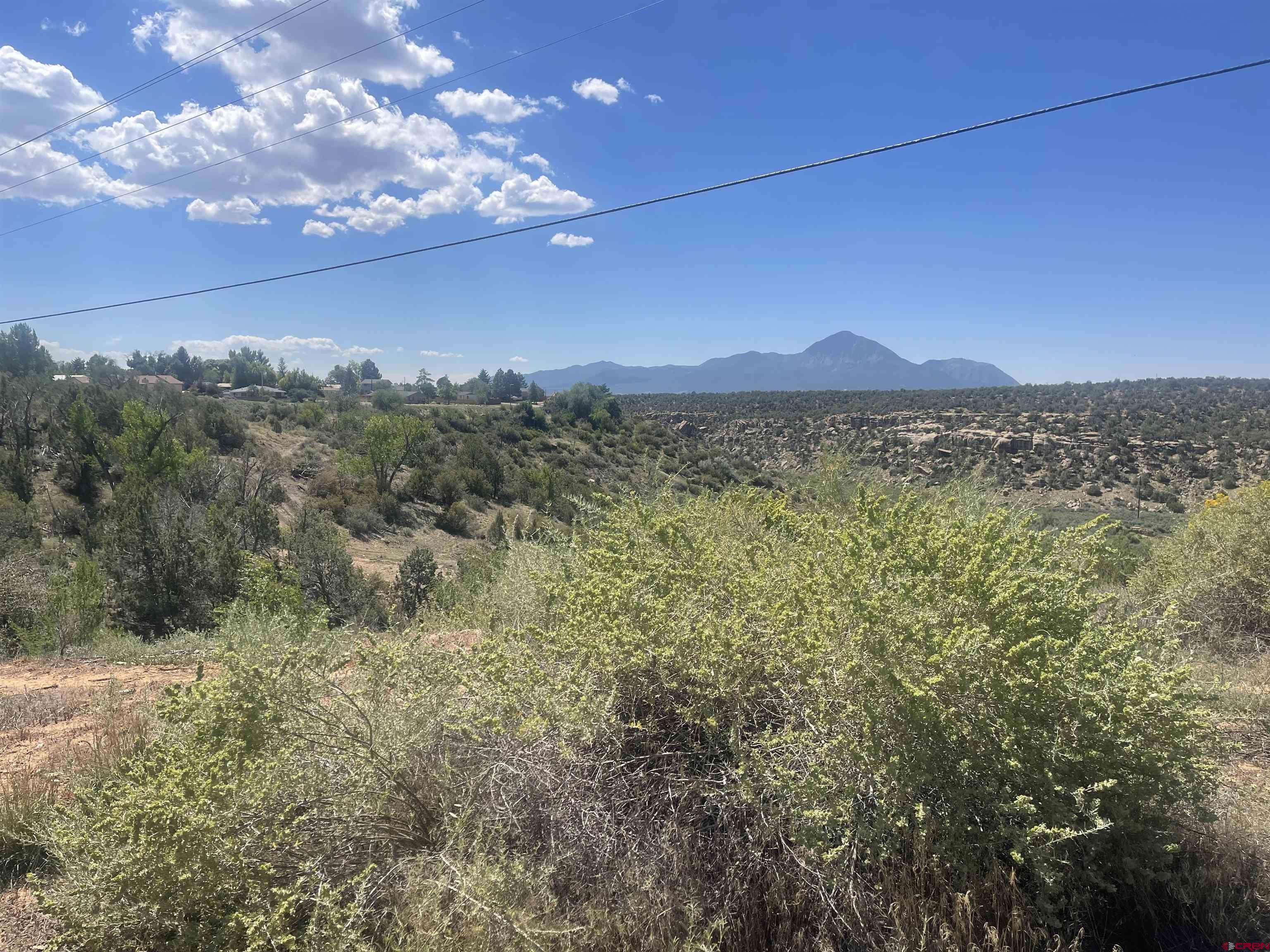 818 Stratton Drive Cortez, CO 81321 - Photo 5 of 10 a view of a lake with a mountain
