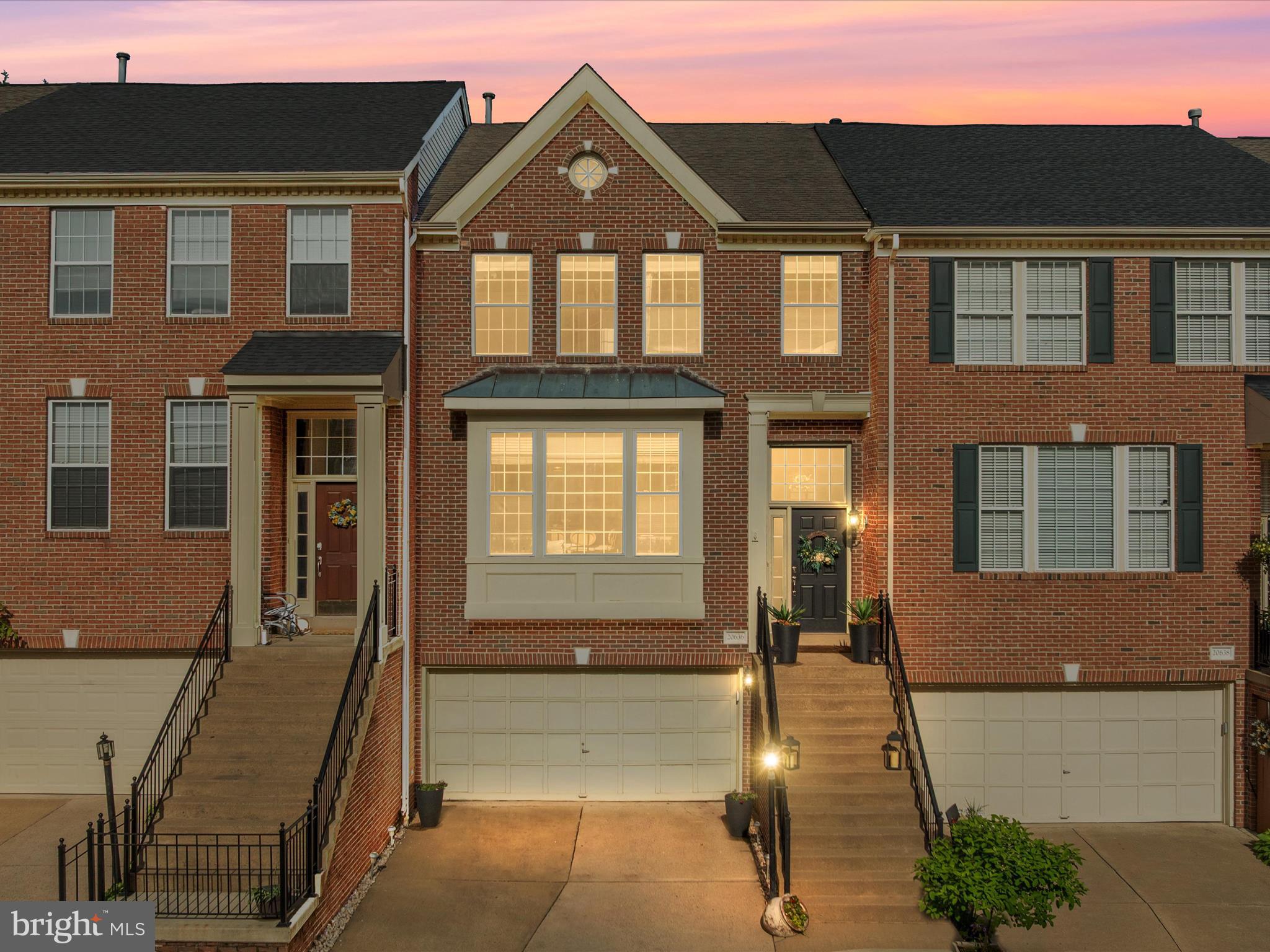 20636 Muddy Harbor Square Sterling, VA 20165 - Photo 1 of 41 a front view of a house with a yard