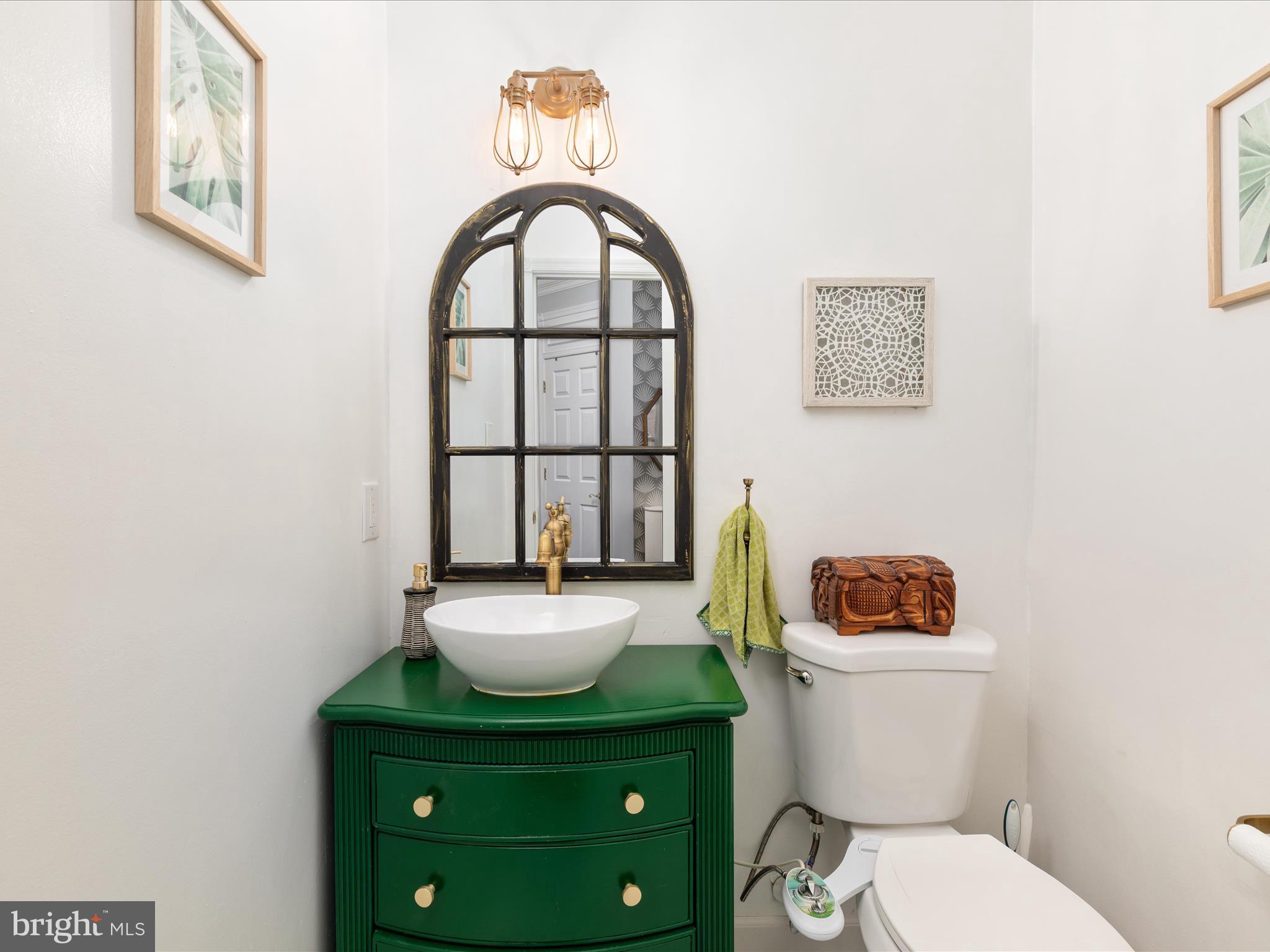 20636 Muddy Harbor Square Sterling, VA 20165 - Photo 11 of 41 a white toilet sitting next to a bathroom sink