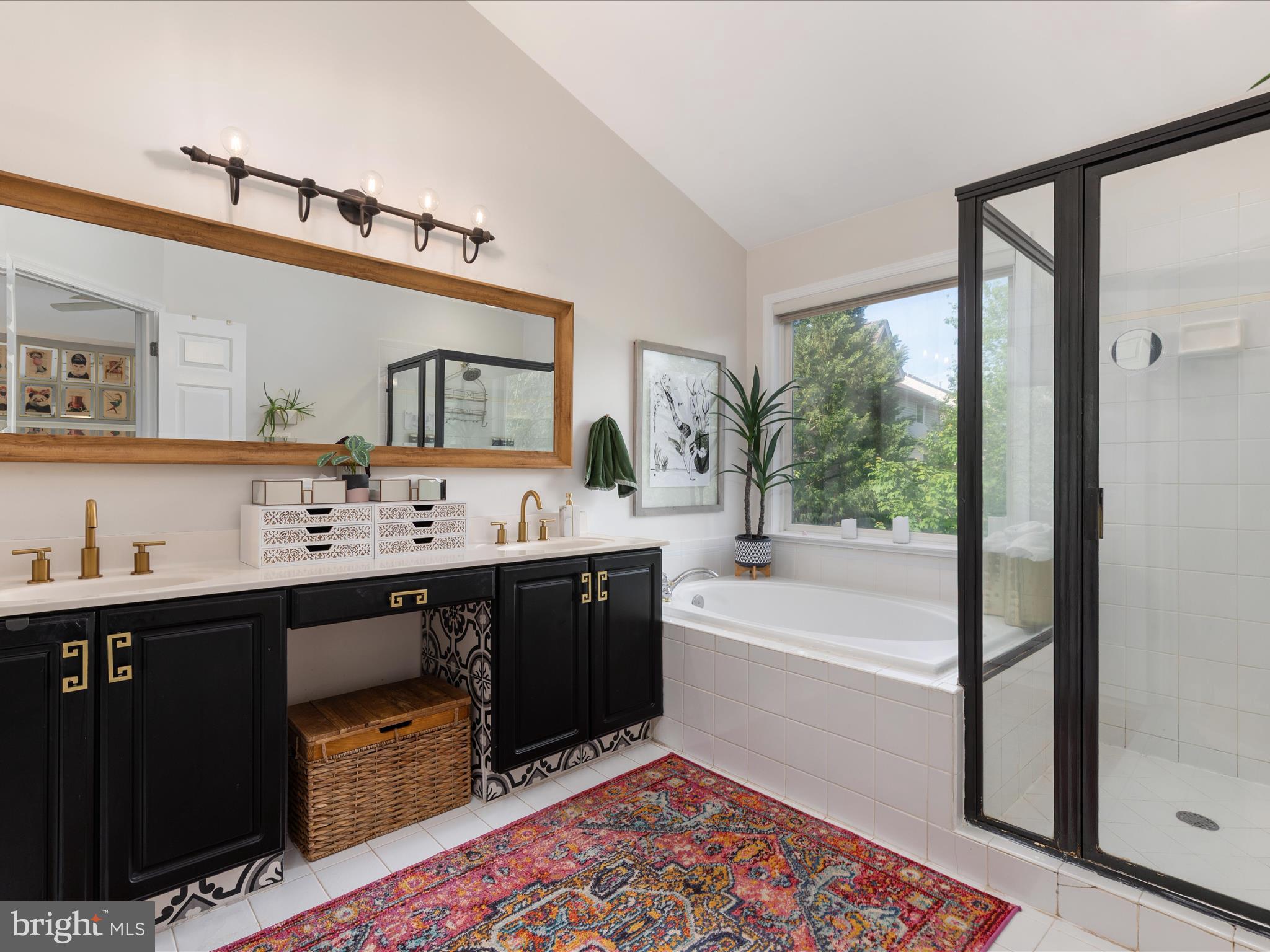 20636 Muddy Harbor Square Sterling, VA 20165 - Photo 15 of 41 a spacious bathroom with a tub double sink and a mirror