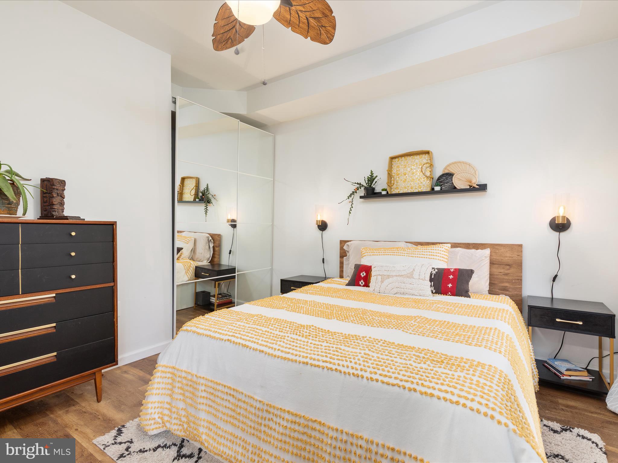 20636 Muddy Harbor Square Sterling, VA 20165 - Photo 22 of 41 a bedroom with a bed and wooden floor