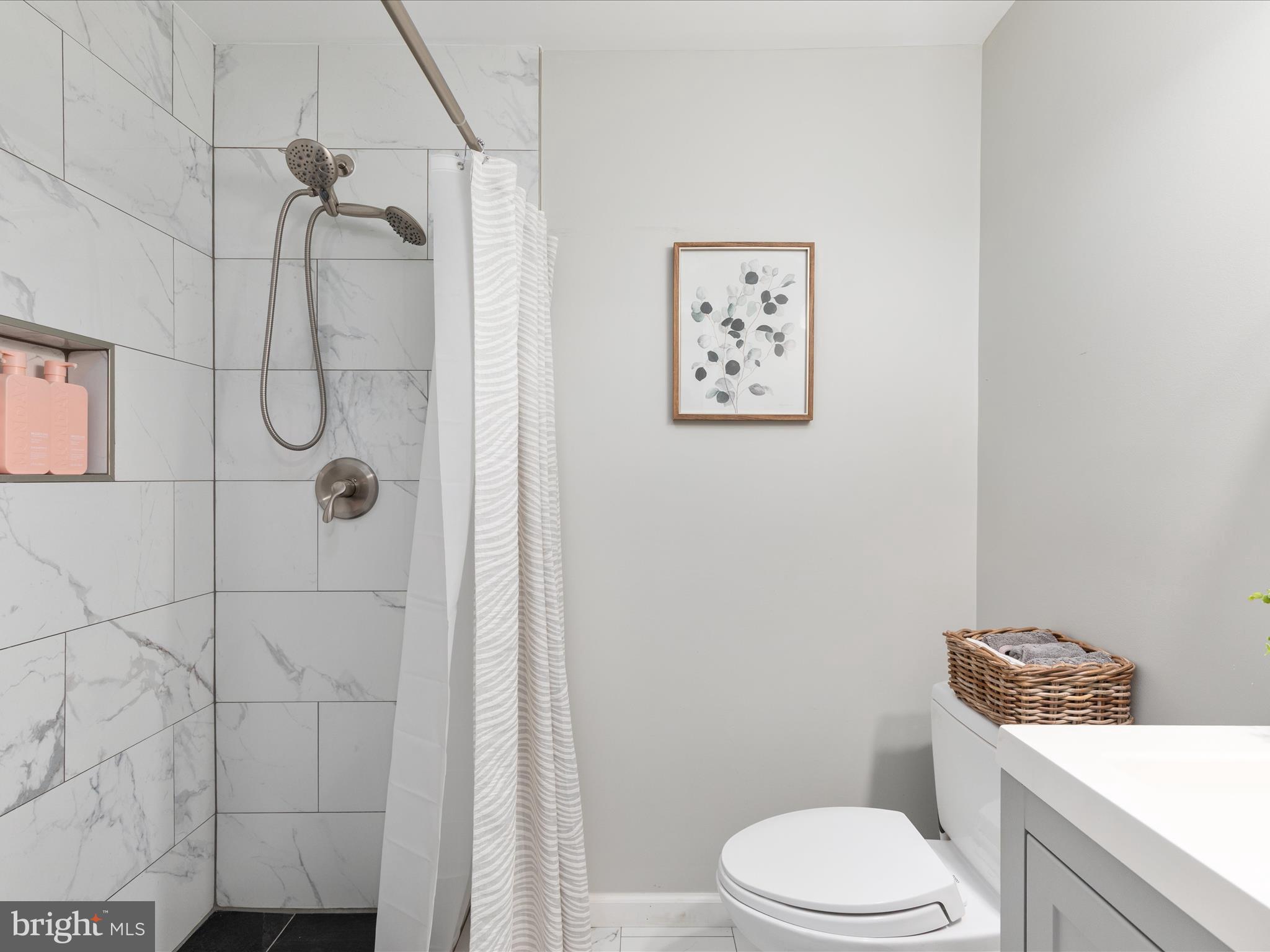 20636 Muddy Harbor Square Sterling, VA 20165 - Photo 24 of 41 a white toilet sitting next to a bathroom sink