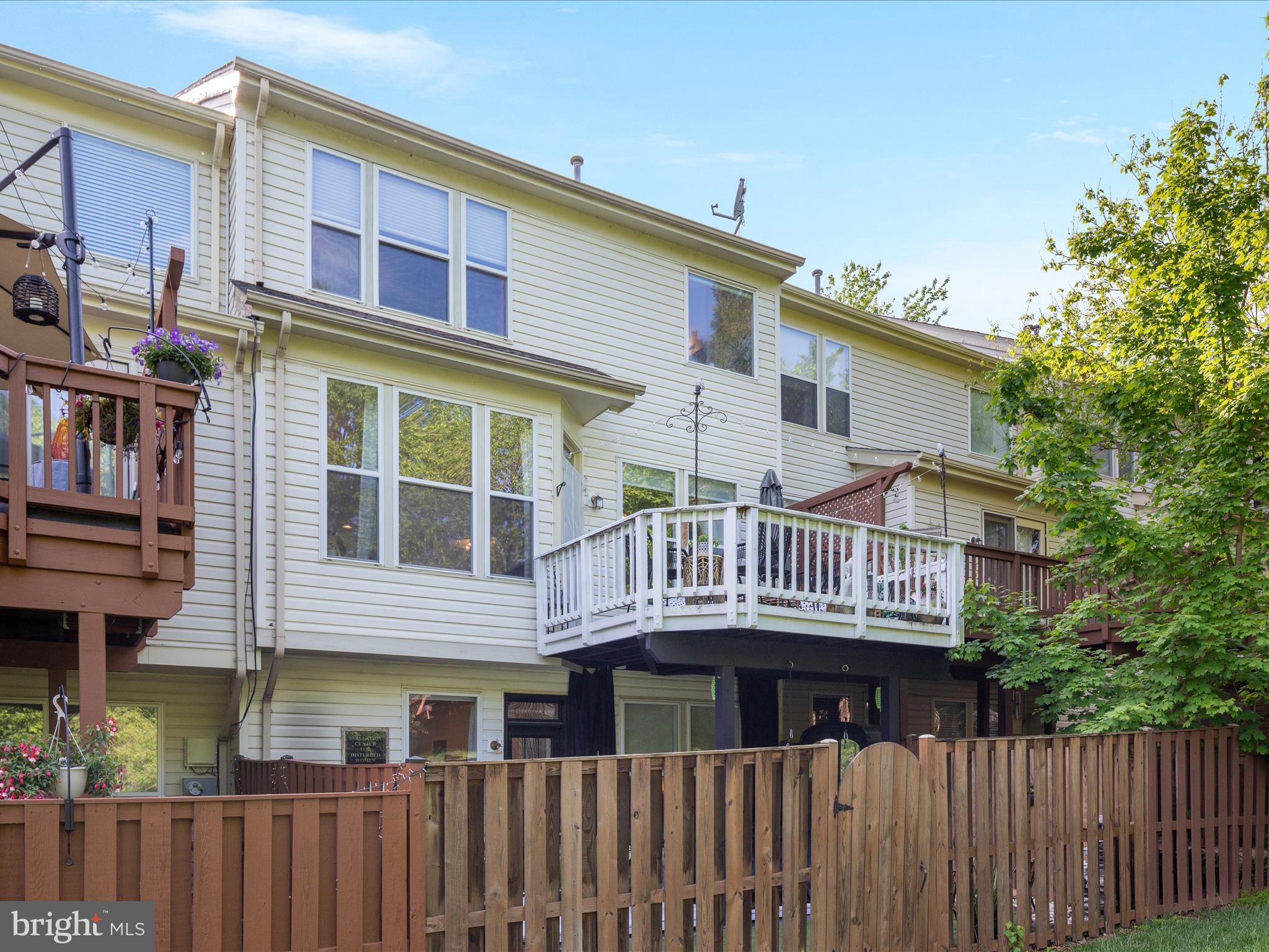 20636 Muddy Harbor Square Sterling, VA 20165 - Photo 29 of 41 a view of a brick building next to a yard