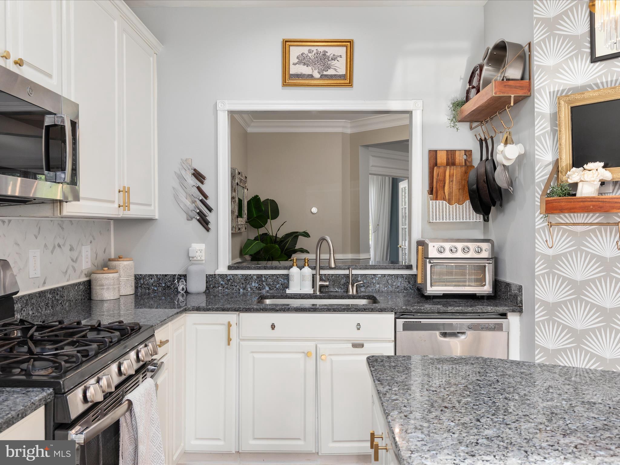 20636 Muddy Harbor Square Sterling, VA 20165 - Photo 4 of 41 a kitchen with stainless steel appliances granite countertop a sink and a stove
