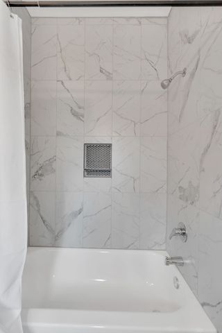 a front view of a house with large windows