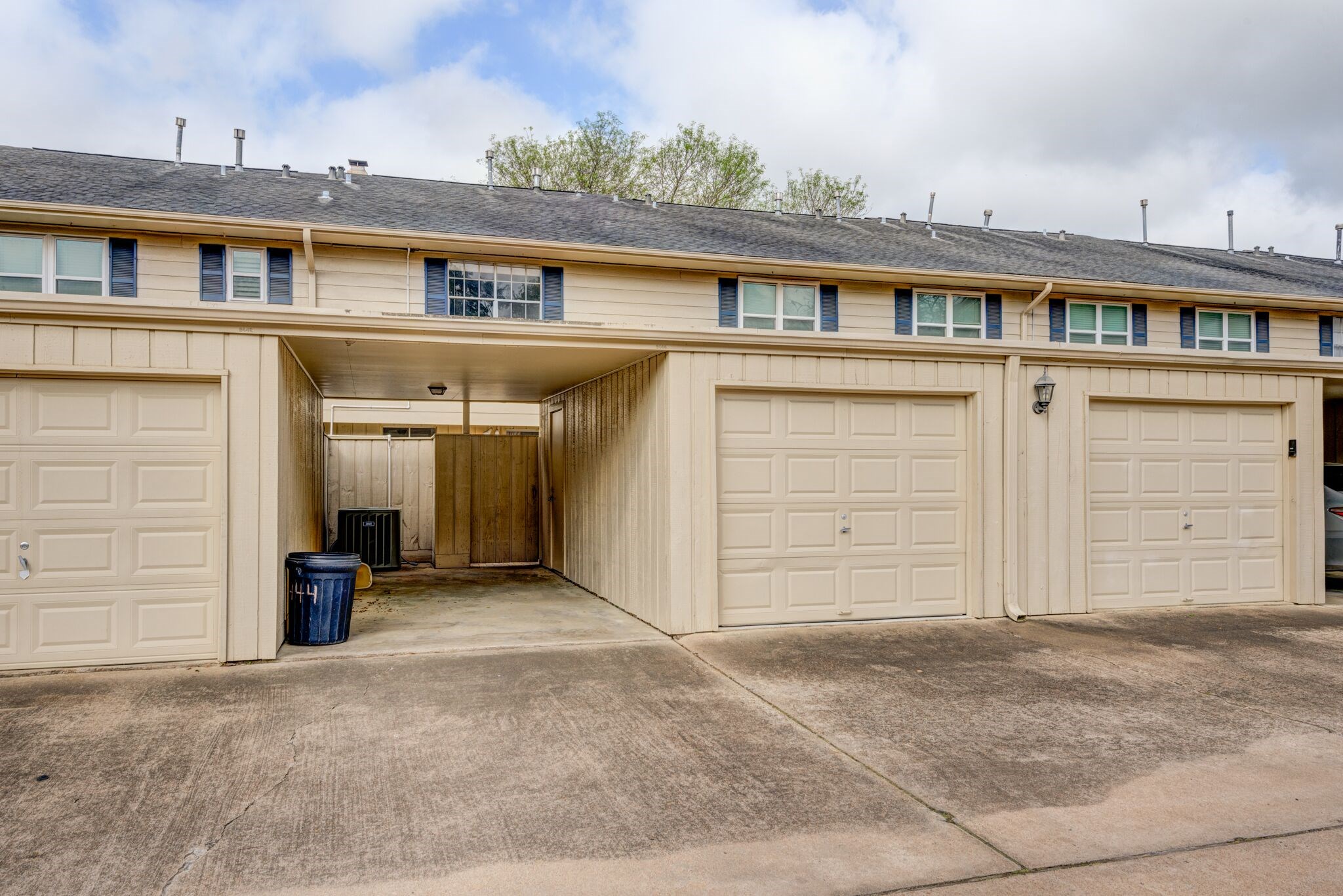 6444 Burgoyne Road, Unit 104 Houston, TX 77057 - Photo 17 of 17 Garage and covered car port