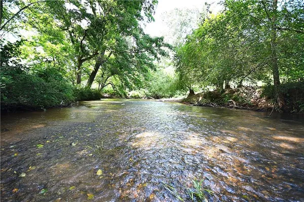 a backyard of a house with lots of green space