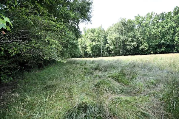 a view of a backyard with sitting area