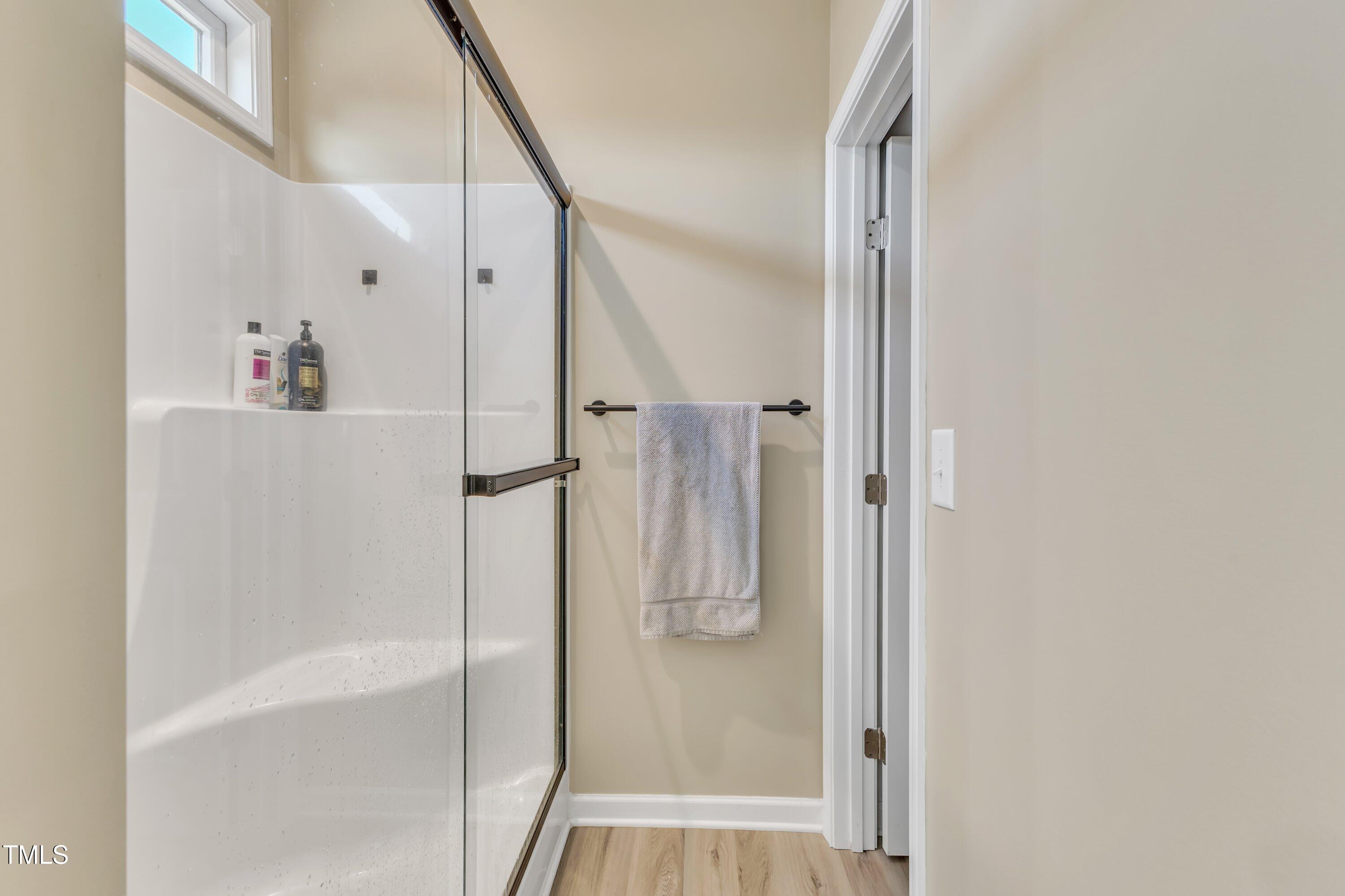10387 Claude Lewis Road Middlesex, NC 27557 - Photo 25 of 37 a bathroom with a bathtub and a shower