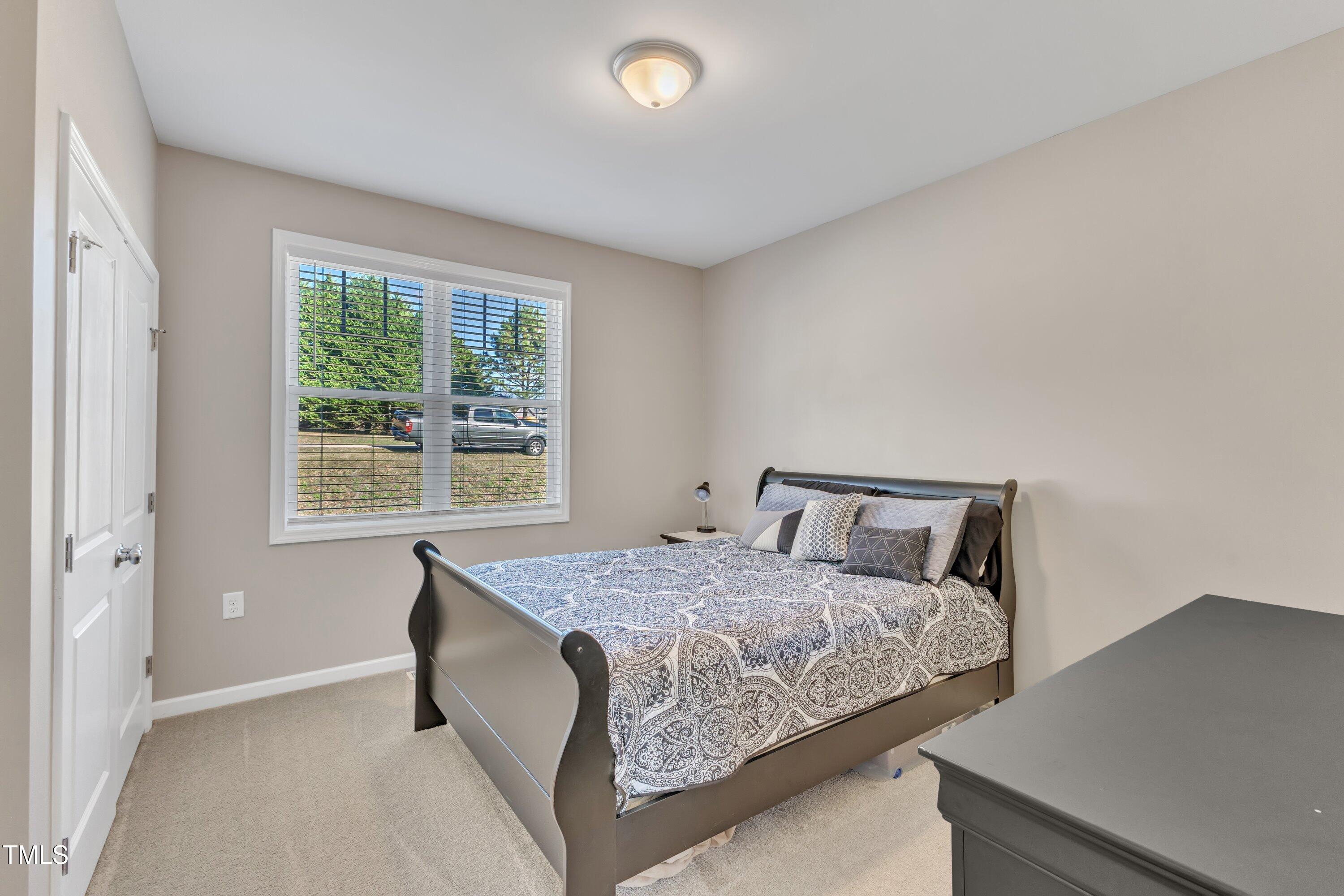 10387 Claude Lewis Road Middlesex, NC 27557 - Photo 26 of 37 a bedroom with a bed and window