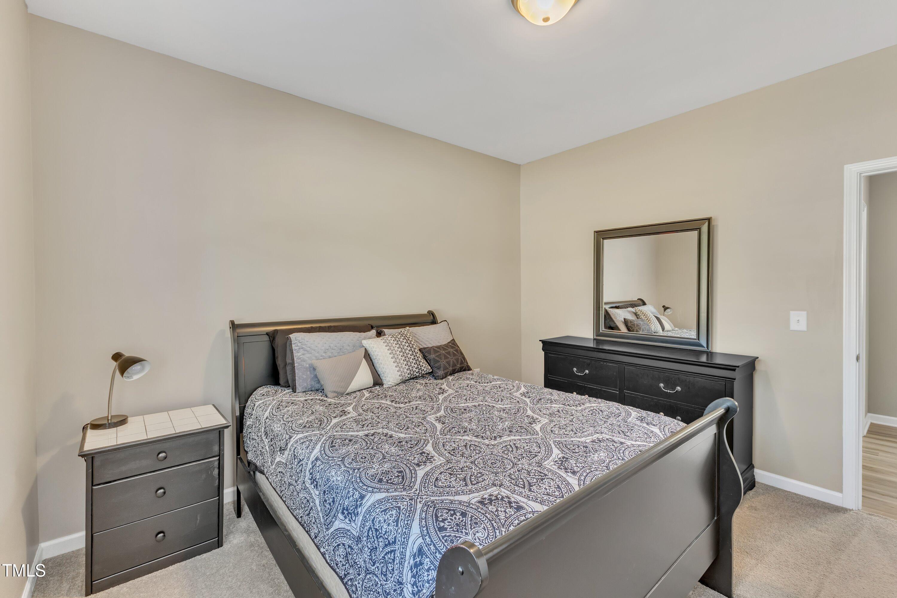 10387 Claude Lewis Road Middlesex, NC 27557 - Photo 27 of 37 a bedroom with a bed and dresser