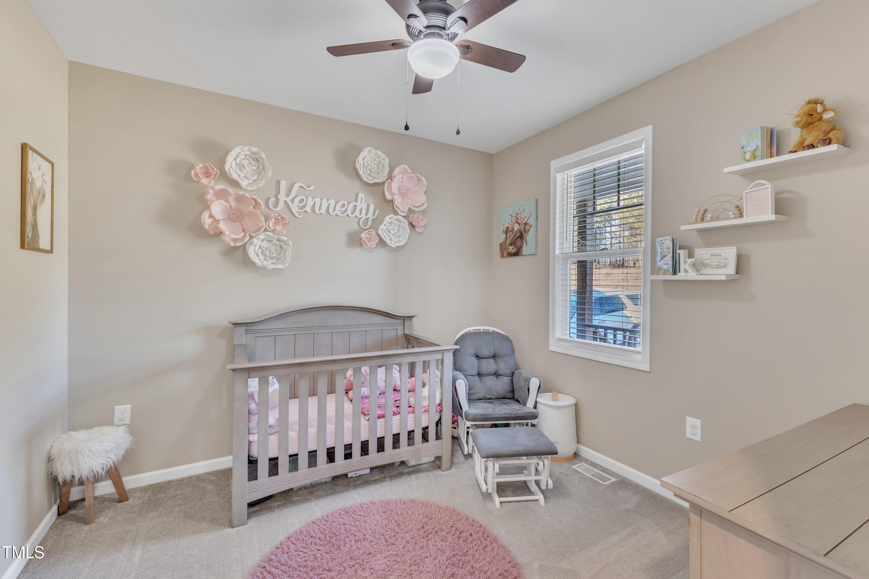 10387 Claude Lewis Road Middlesex, NC 27557 - Photo 29 of 37 a bedroom with furniture and a window