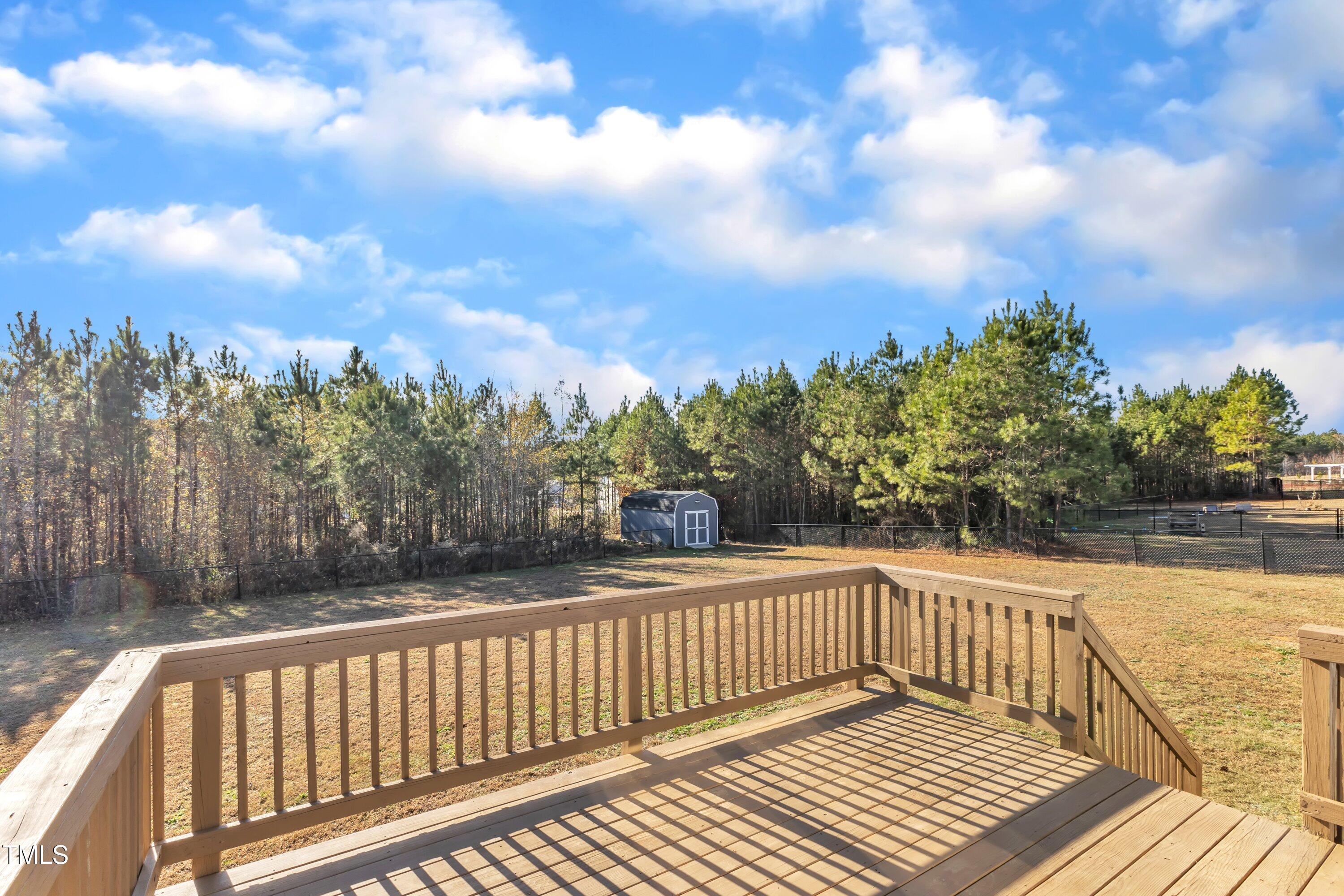 10387 Claude Lewis Road Middlesex, NC 27557 - Photo 36 of 37 a view of balcony with wooden floor and fence