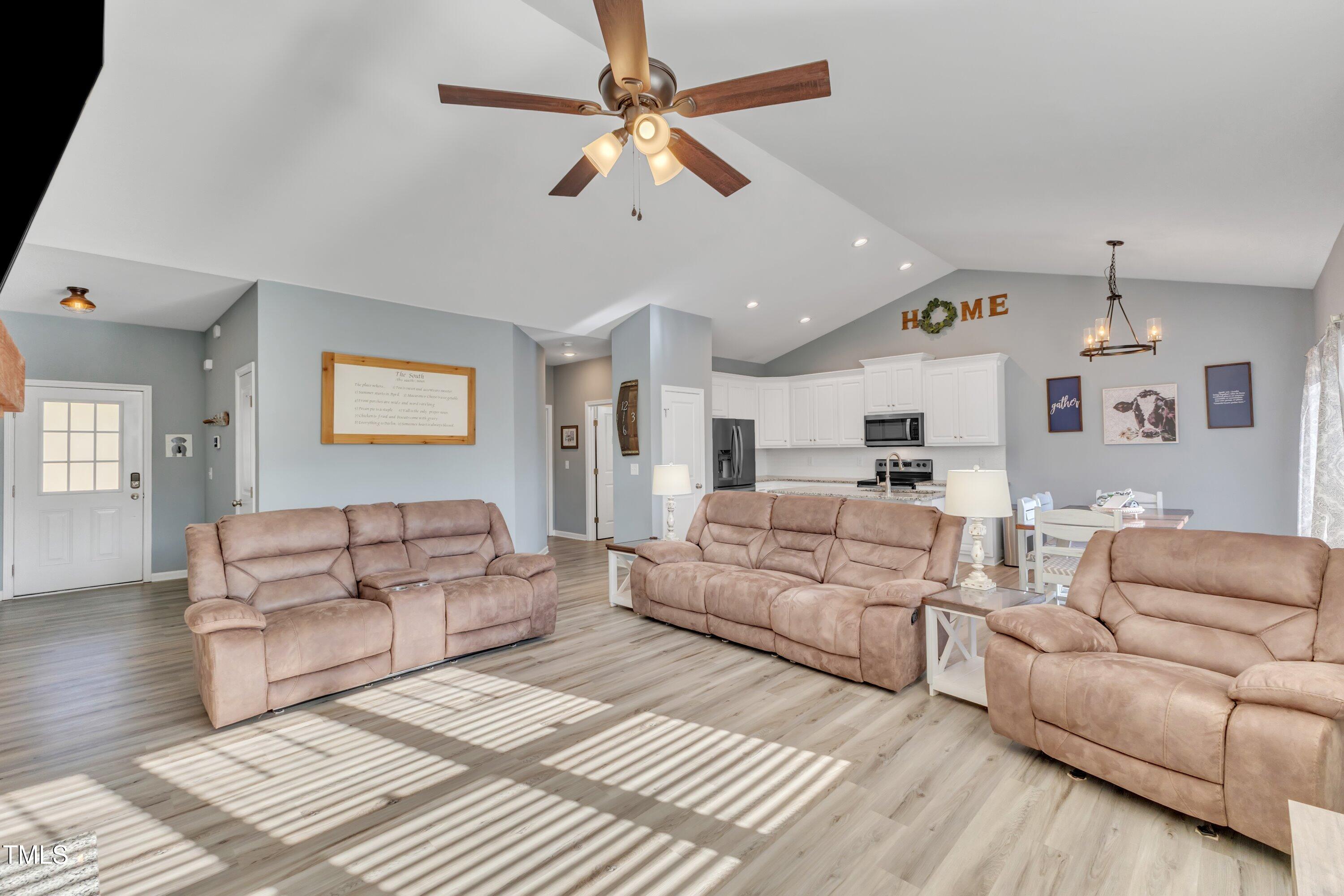 10387 Claude Lewis Road Middlesex, NC 27557 - Photo 9 of 37 a living room with furniture white walls and ceiling fan