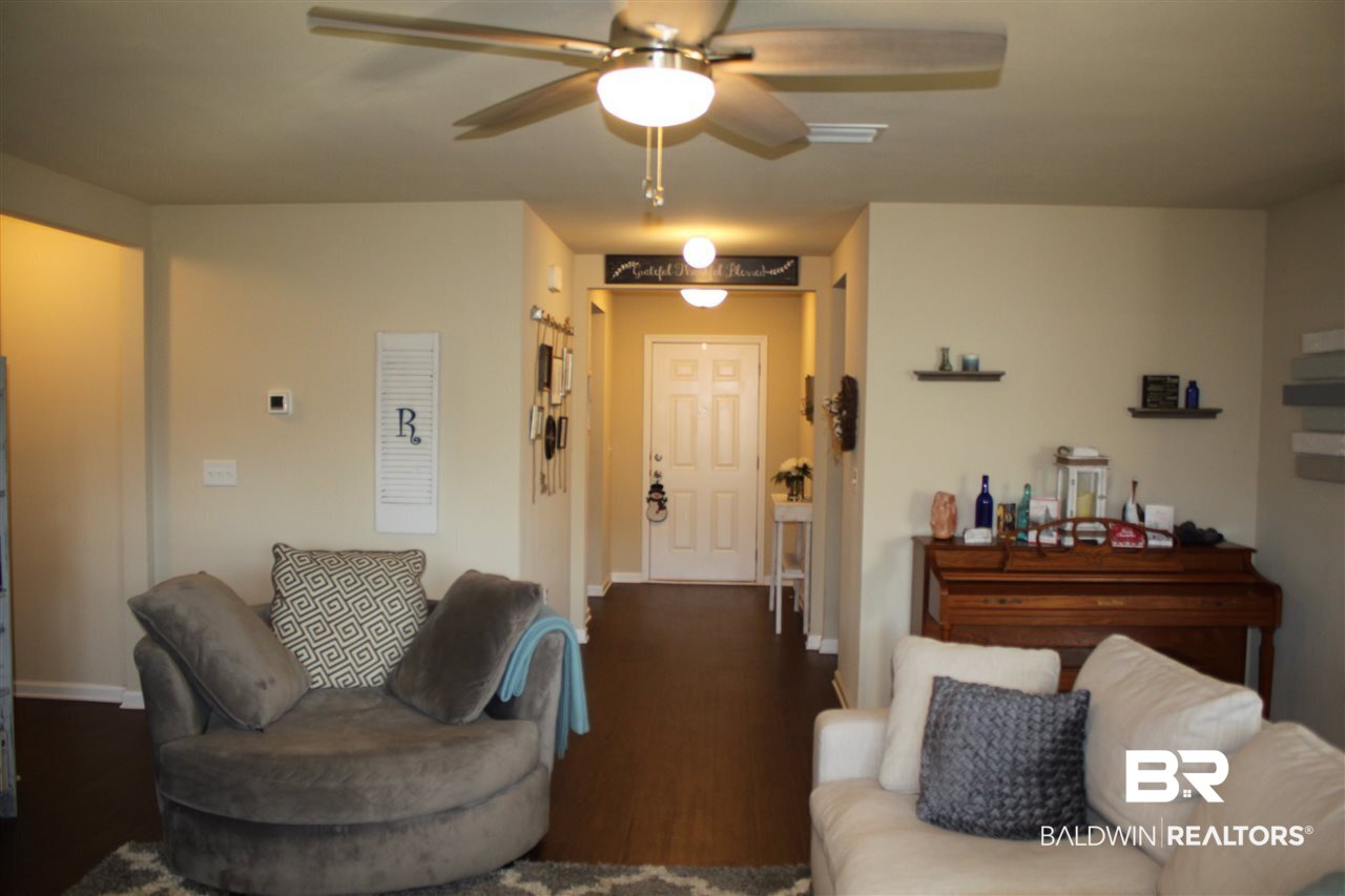6951 Crimson Ridge Street Gulf Shores, AL 36542 - Photo 17 of 33 Living Room and Front Ent