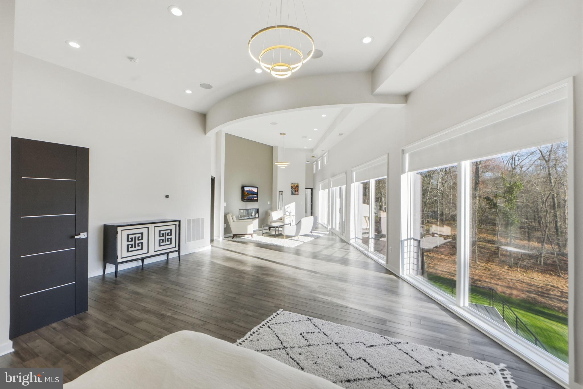 2368 Hunter Mill Road Vienna, VA 22181 - Photo 33 of 74 a lobby with furniture and floor to ceiling window