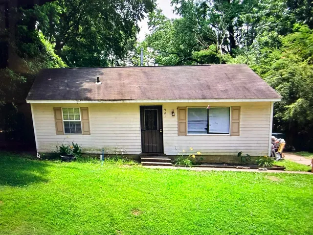a view of a backyard with a garden