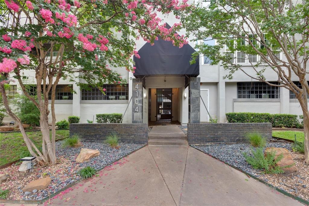 4104 North Hall Street, Unit 102 Dallas, TX 75219 - Photo 2 of 18 Entryway featuring a black awning, dark security door, and numerical address display