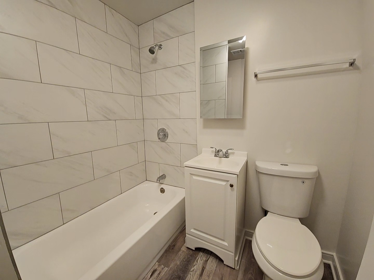 2216 West 21st Place, Unit 1F Chicago, IL 60608 - Photo 8 of 15 a white toilet sitting next to a bath tub