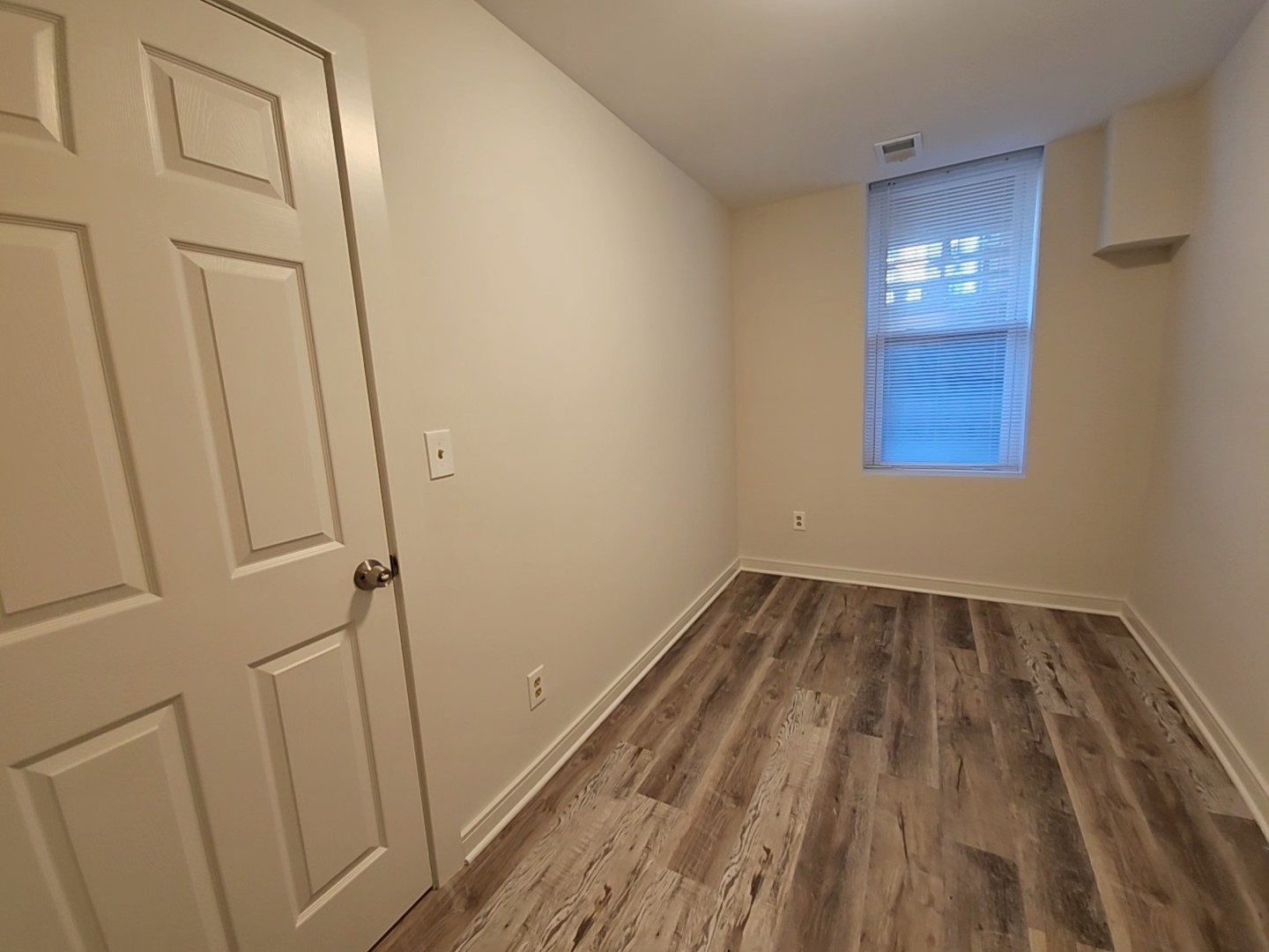 2216 West 21st Place, Unit 1F Chicago, IL 60608 - Photo 10 of 15 a view of empty room with wooden floor
