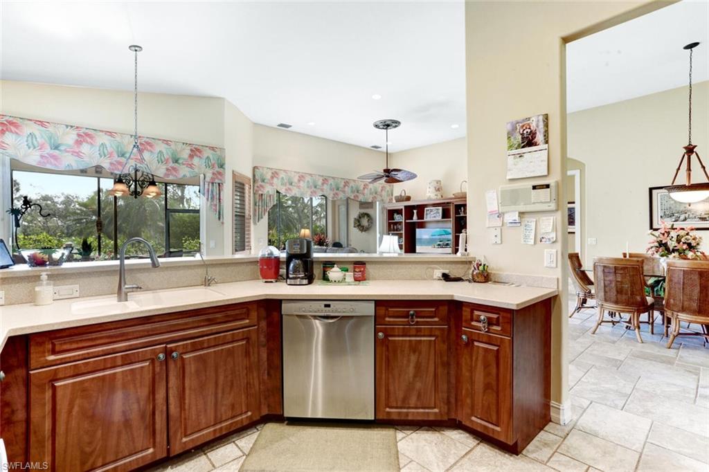 20871 Torrey Pines Way Estero, FL 33928 - Photo 15 of 43 a kitchen with a sink and cabinets