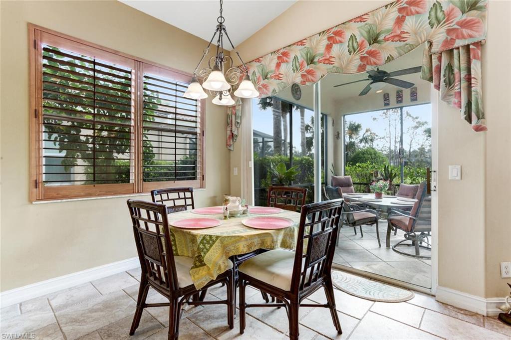 20871 Torrey Pines Way Estero, FL 33928 - Photo 16 of 43 a view of a dining room with furniture window and outside view