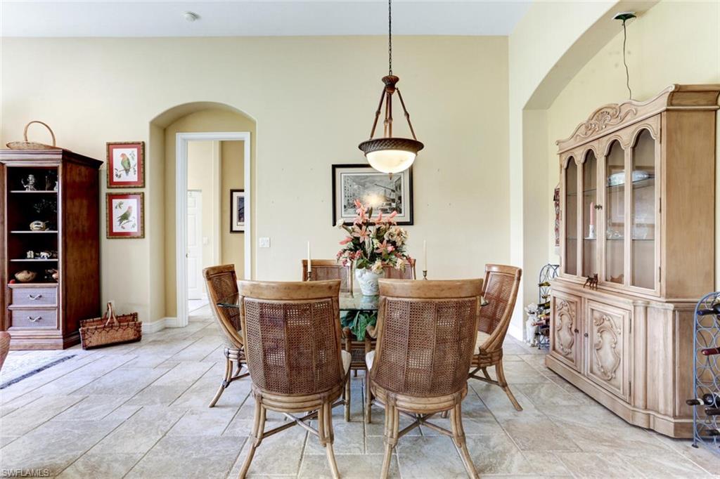 20871 Torrey Pines Way Estero, FL 33928 - Photo 18 of 43 a view of a dining room with furniture and wooden floor