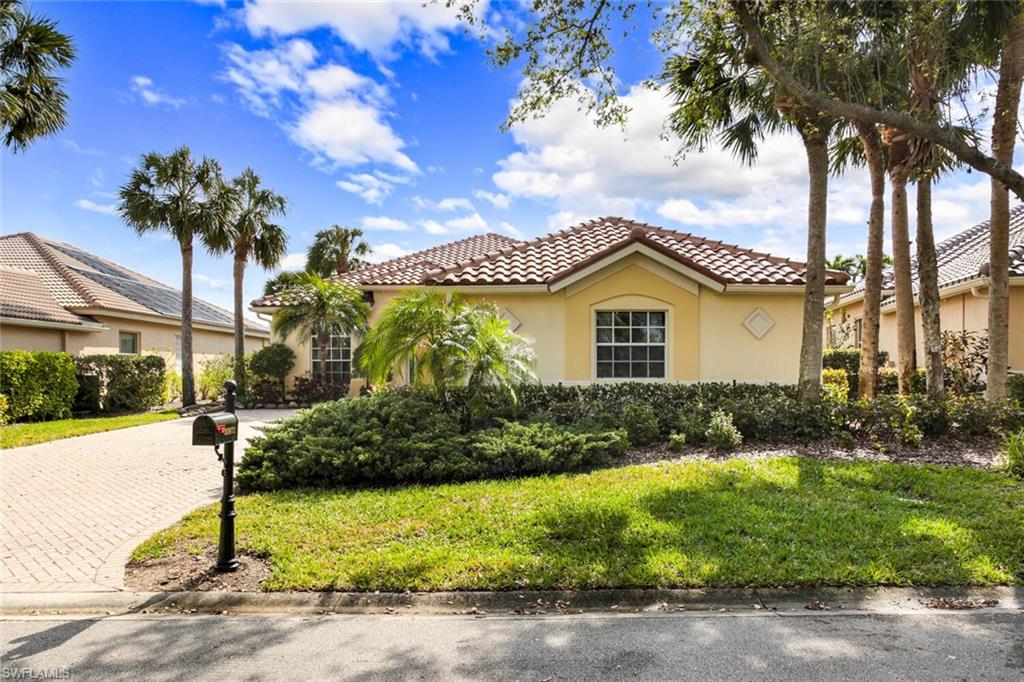 20871 Torrey Pines Way Estero, FL 33928 - Photo 2 of 43 a view of backyard of house with green space